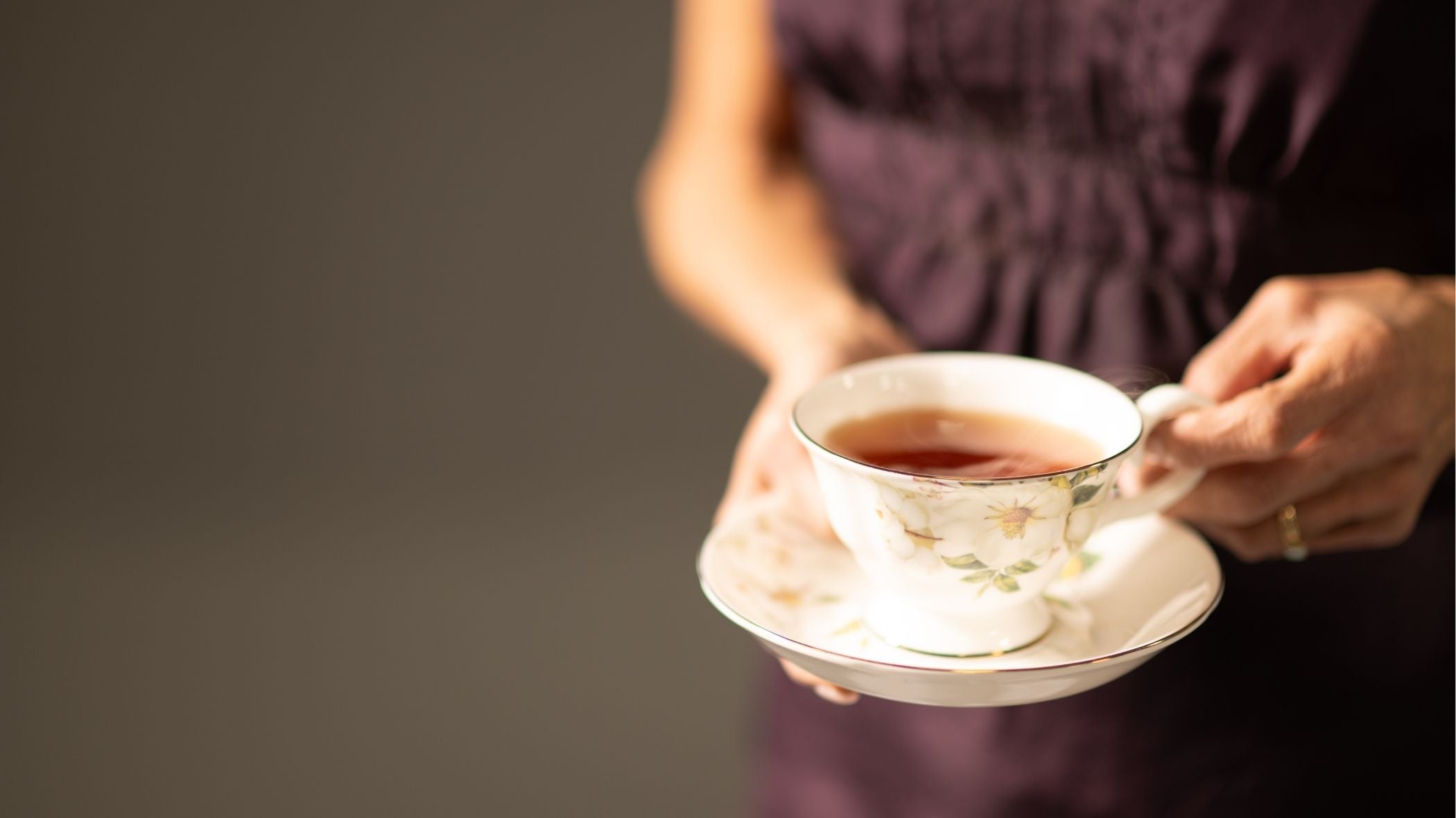 Customers enjoying loose leaf tea together inside Churchill’s Fine Teas in Cincinnati, a welcoming tea shop focused on community, culture, and connection.